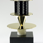 <p><strong><a href=ettore-sottsass.html class=link-lightbox>Ettore Sottsass</a></strong><br />Bharata</p><p><strong>Ombrello di Buddha</strong><br />Flower vase in stone, marble, silver and gold plated<br />20 x 20 x h. 4cm.</p>