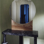 <p><strong><a href=ettore-sottsass.html class=link-lightbox>Ettore Sottsass</a></strong><br />Bharata</p><p><strong>Specchio Rotondo</strong><br />Side table with mirror in marble and “serena” stone.<br />105 x 155 x h. 205 cm. </p>